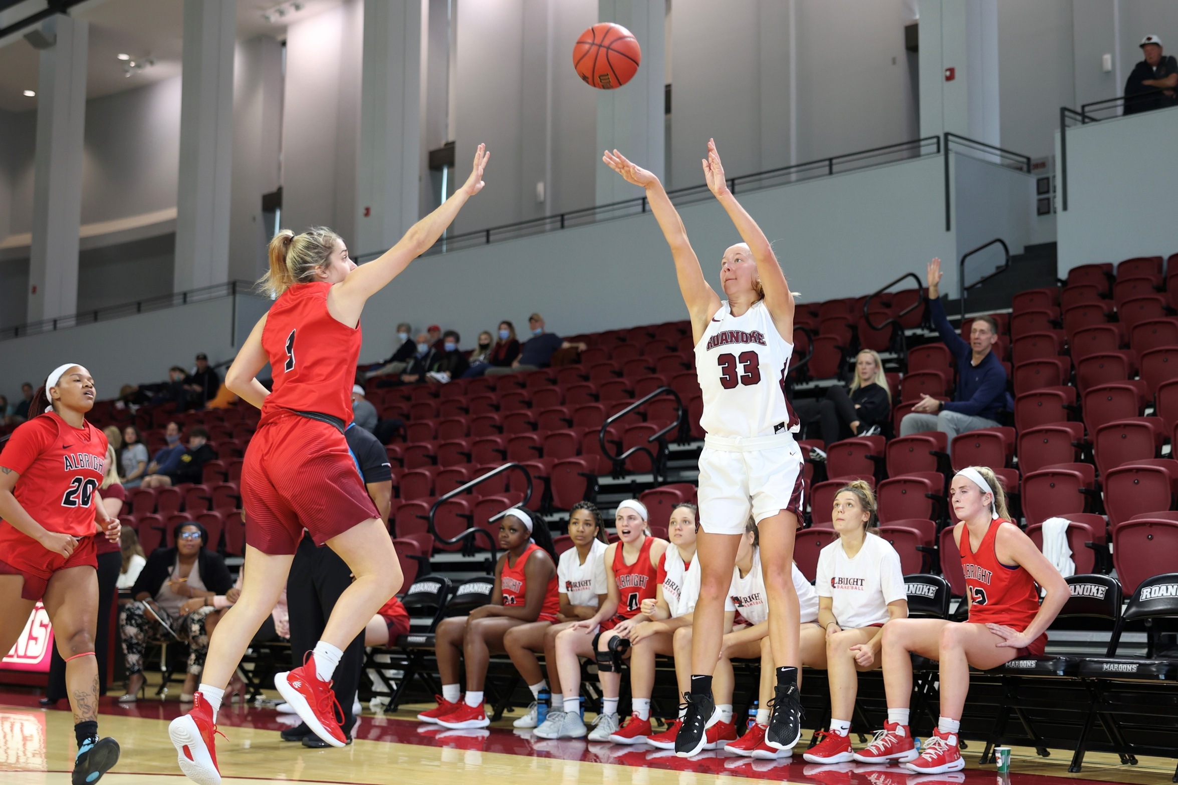 action photo of RC basketball player Rose Sande with a jump shot