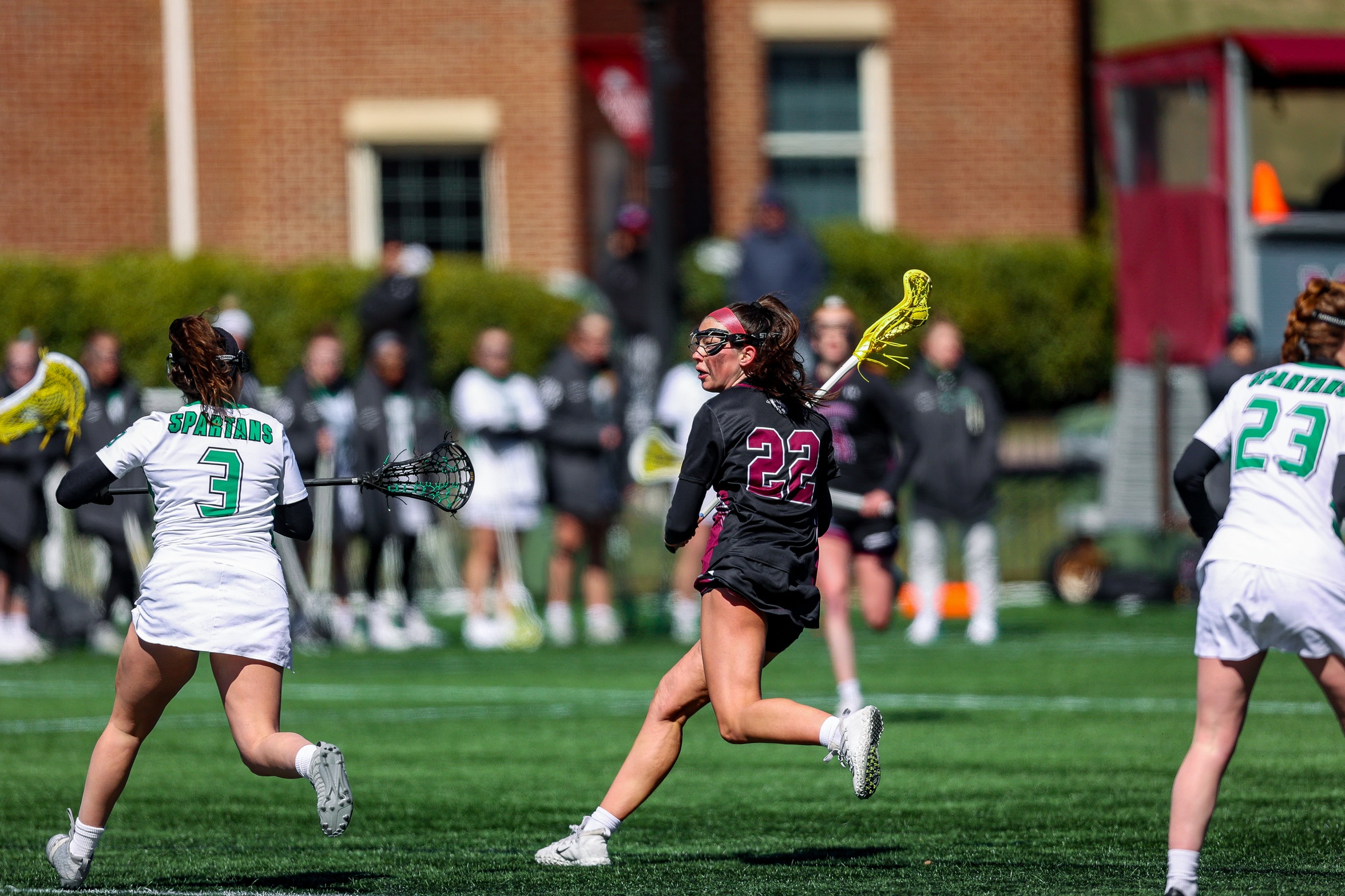 action photo of RC women's lax player Riley Chase
