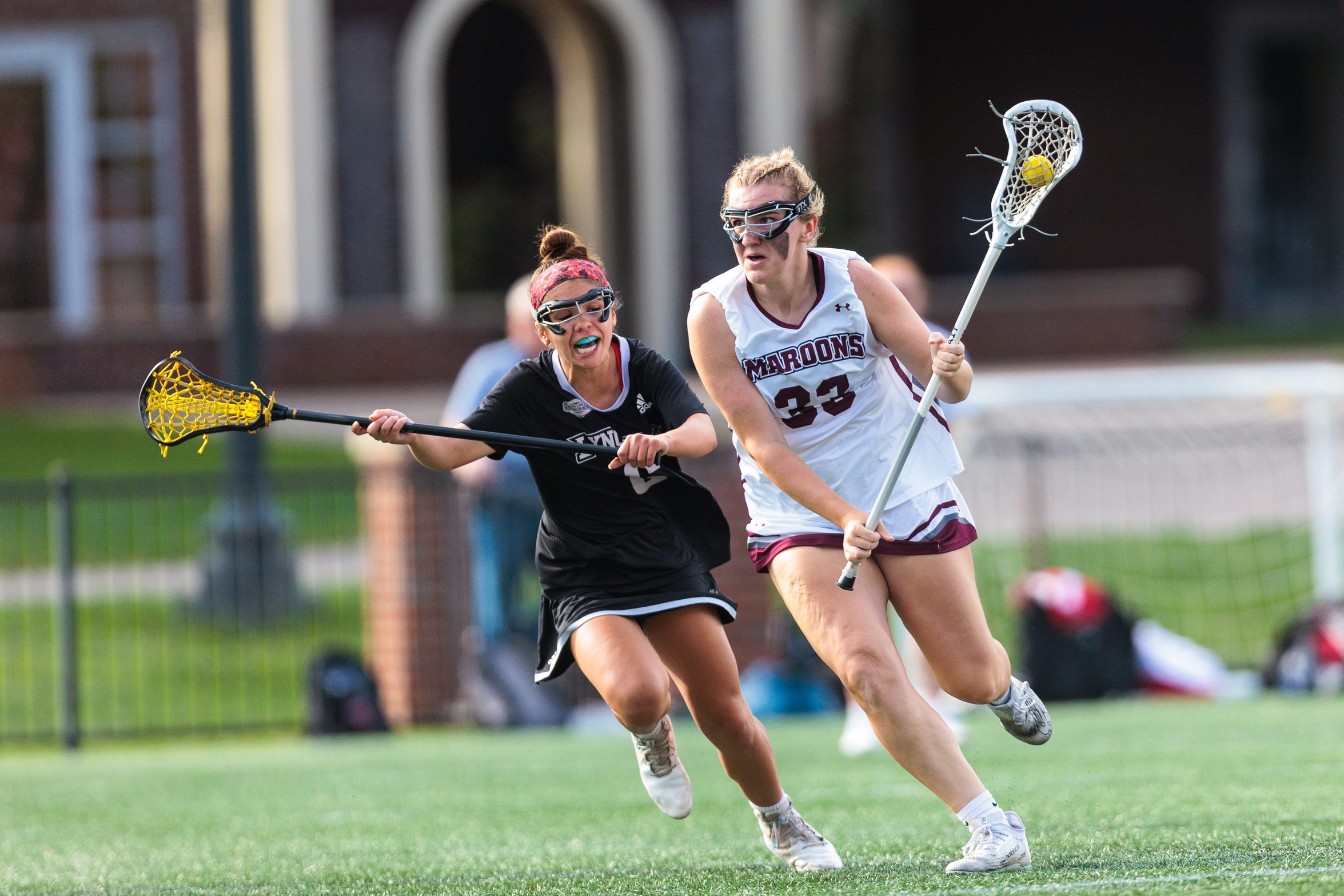 action photo of RC women's lacrosse player Grace Koutouzis