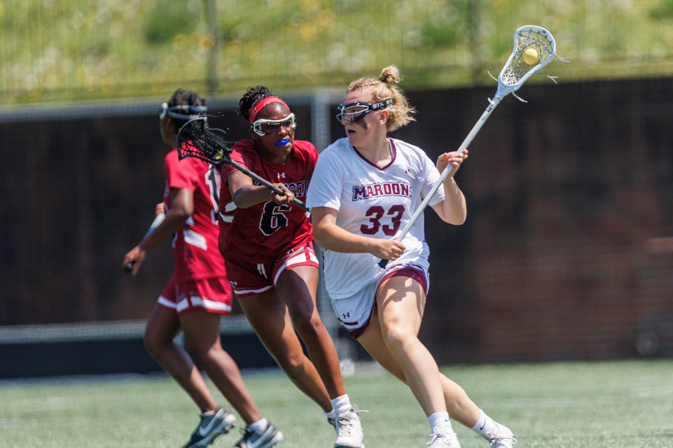 action photo of RC women's lacrosse player Grace Koutouzis