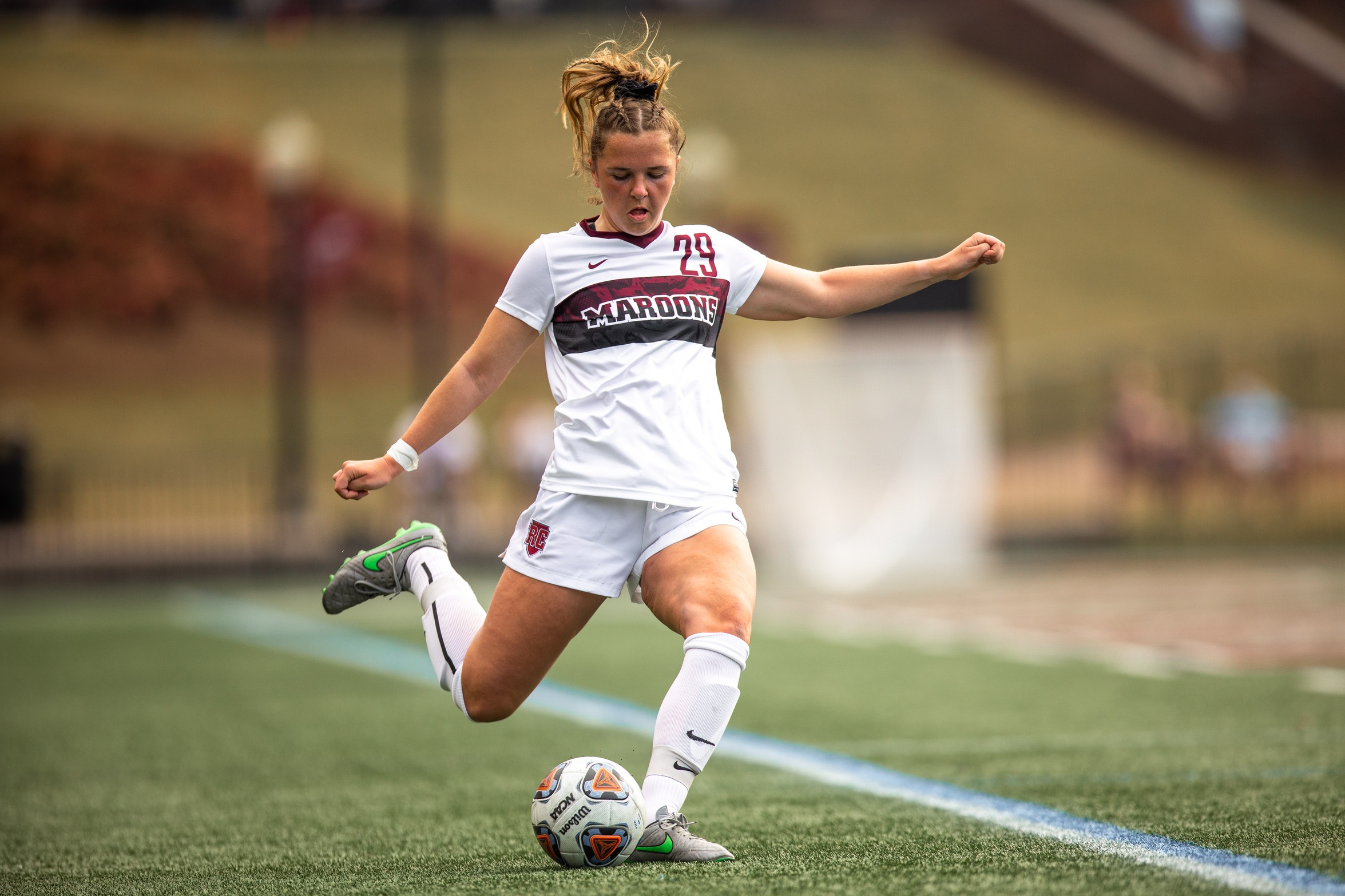 action photo of RC soccer player Eliza Ryan kicking