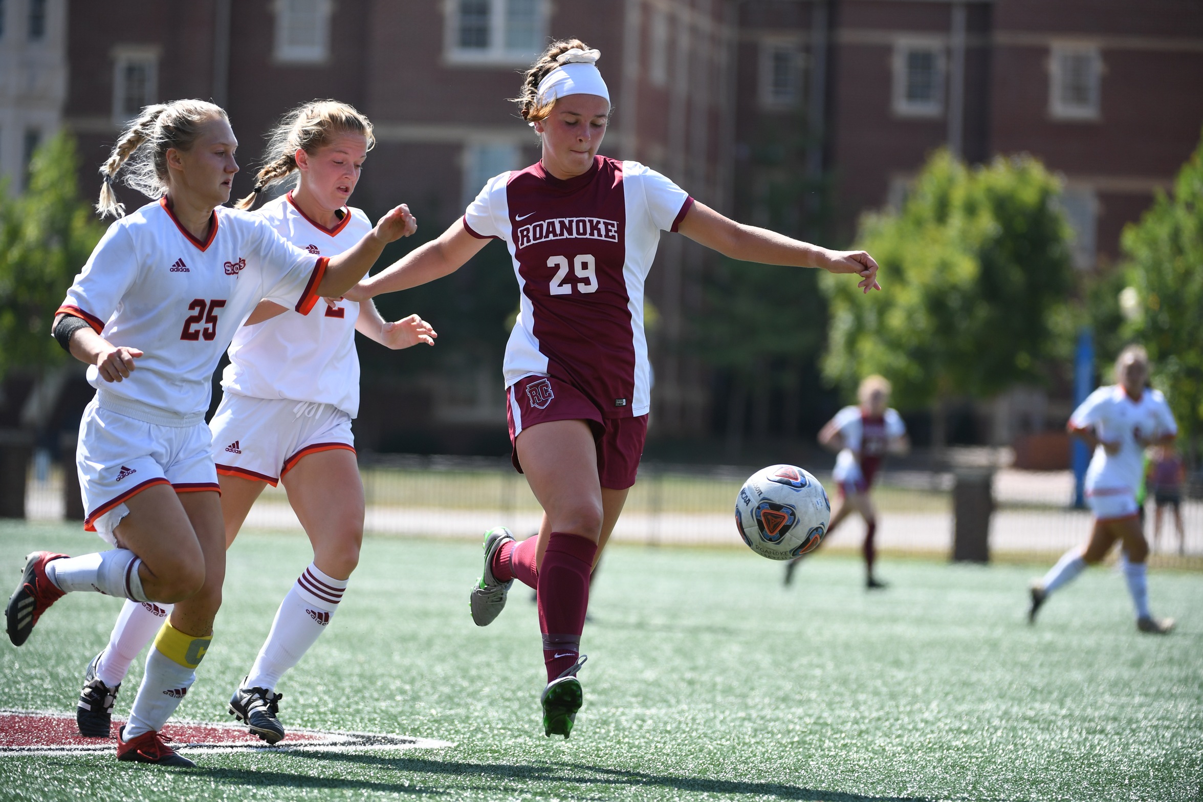 action photo of RC soccer player Eliza Ryan going after the loose ball