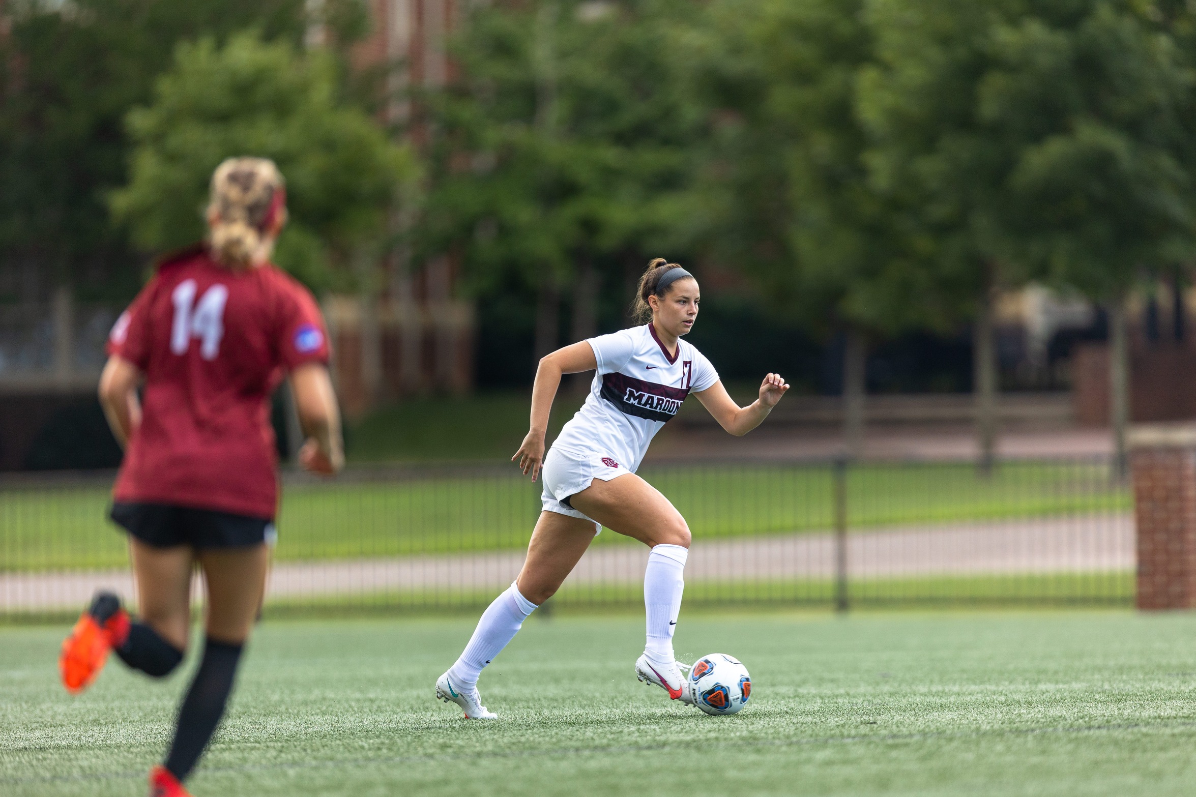 action photo of RC women's soccer defender Erin Flamm