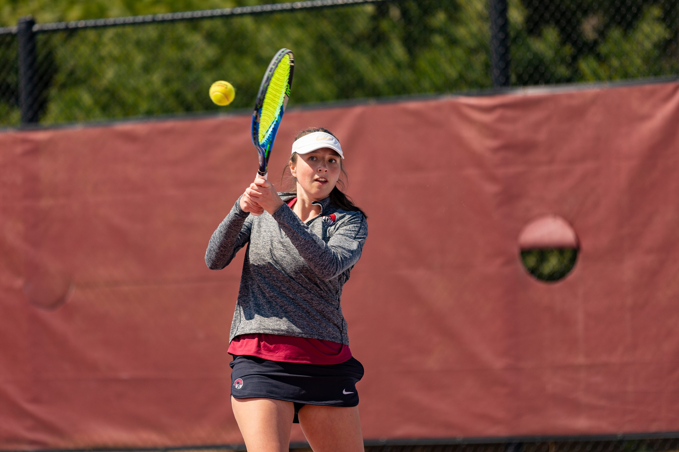 action photo of RC women's tennis player Sophie Baratholomus