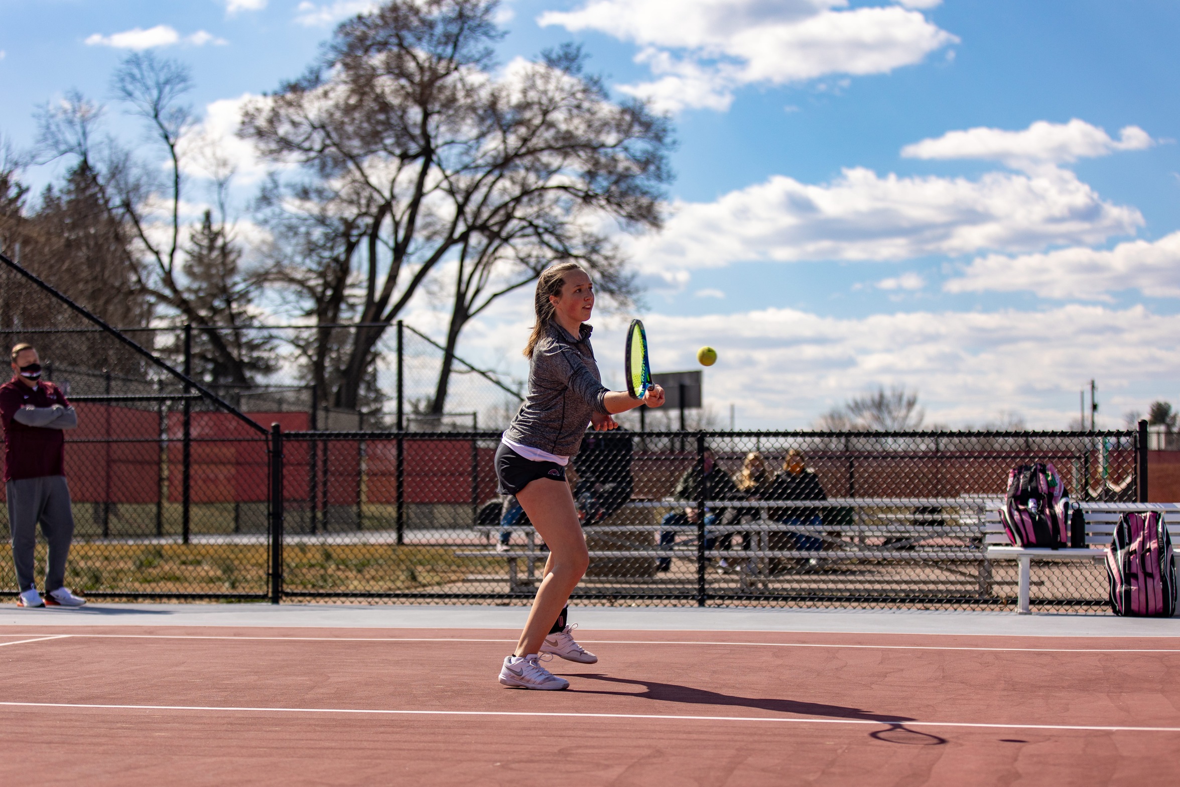 action photo of RC women's tennis player at the net
