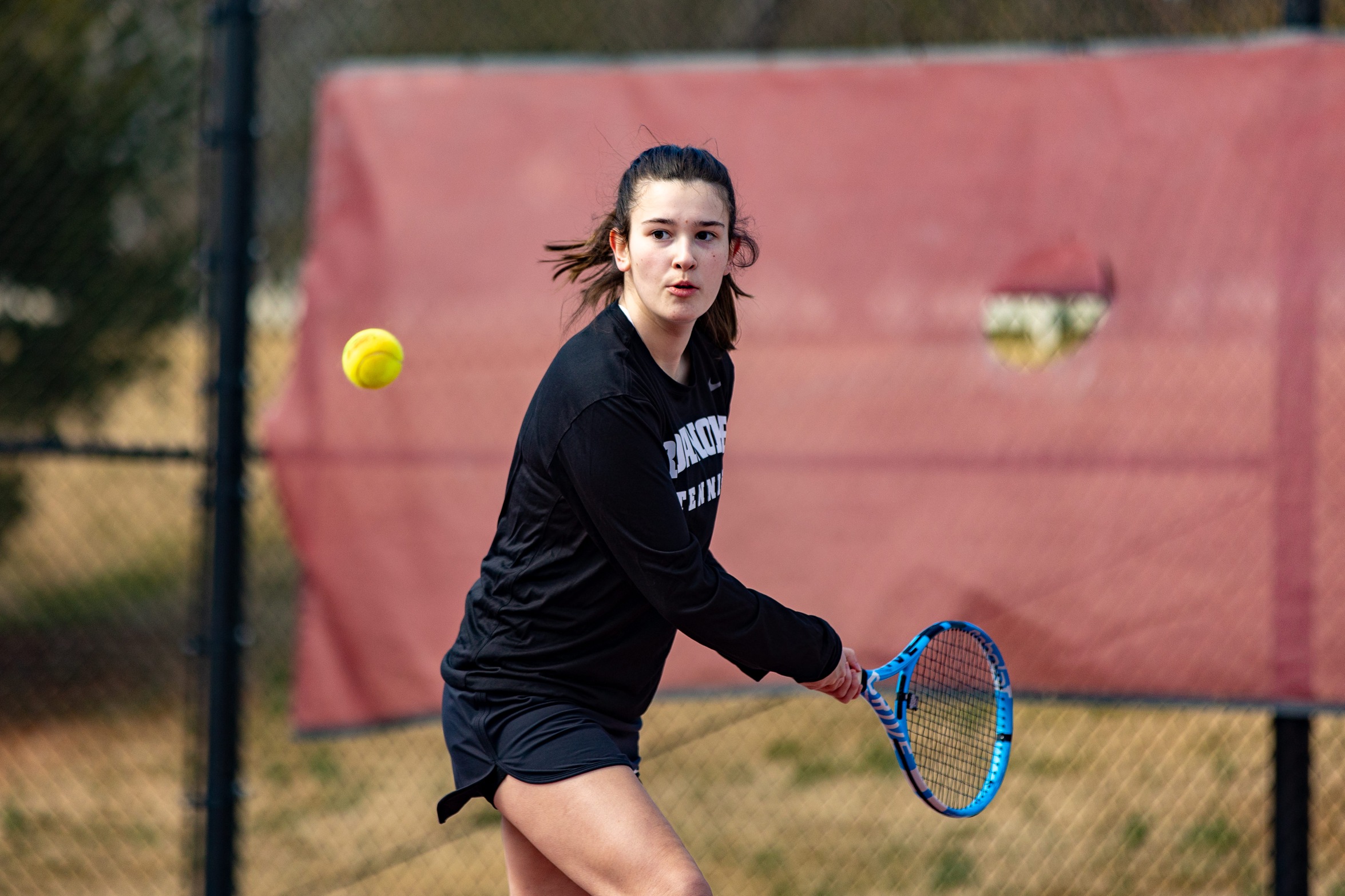 action photo of Roanoke tennis player returning a shot