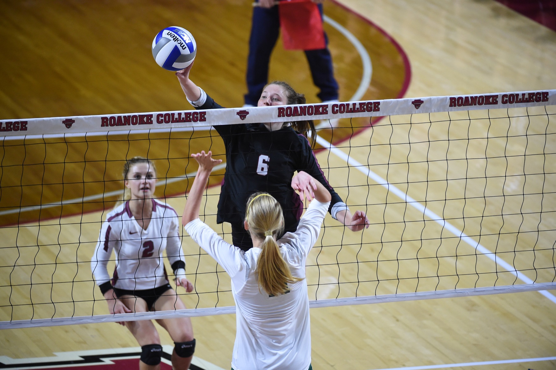action photo of Roanoke volleyball player Parker Moody attacking the ball