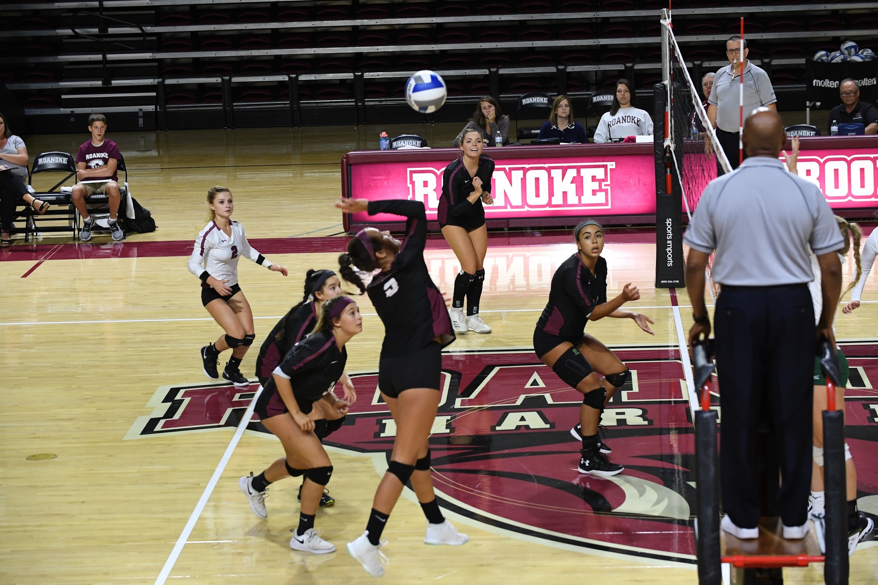 action photo of RC volleyball player Angel Ross (9) attacking cross court