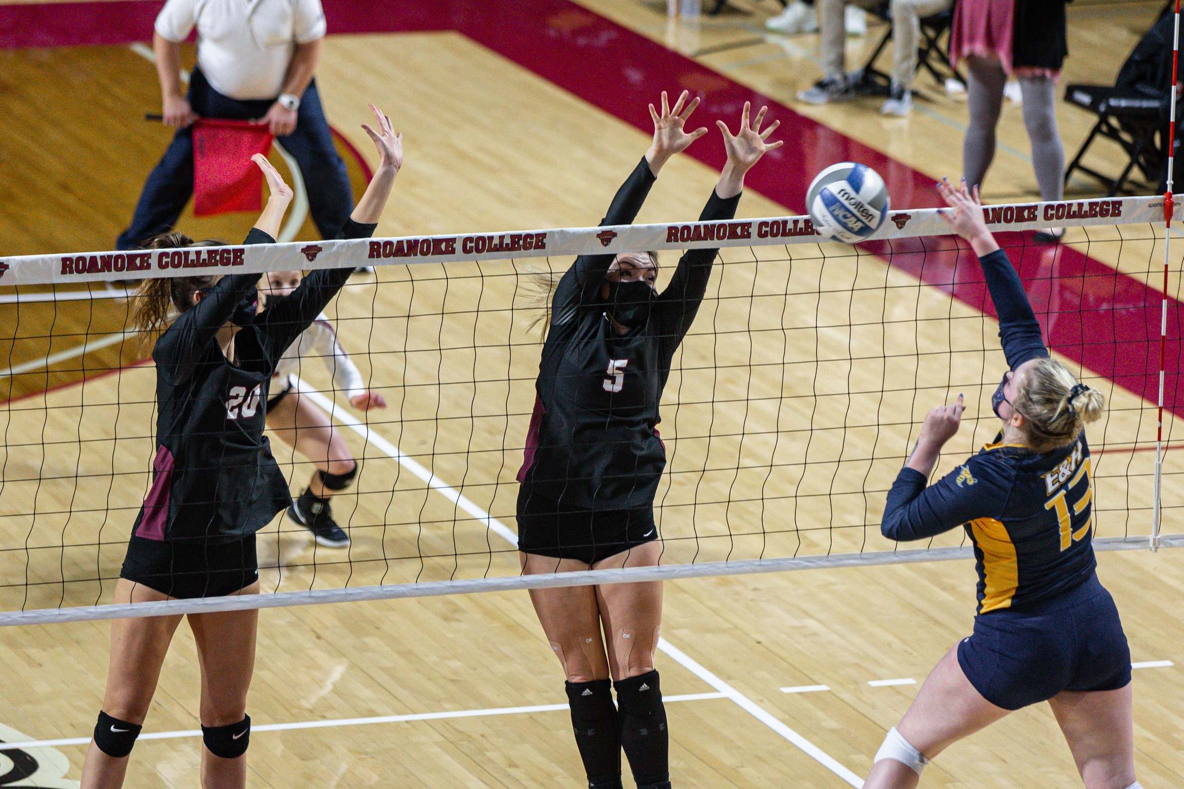 action photo of RC volleyball players Linsey Bailey and Ryanna Clark blocking at the net