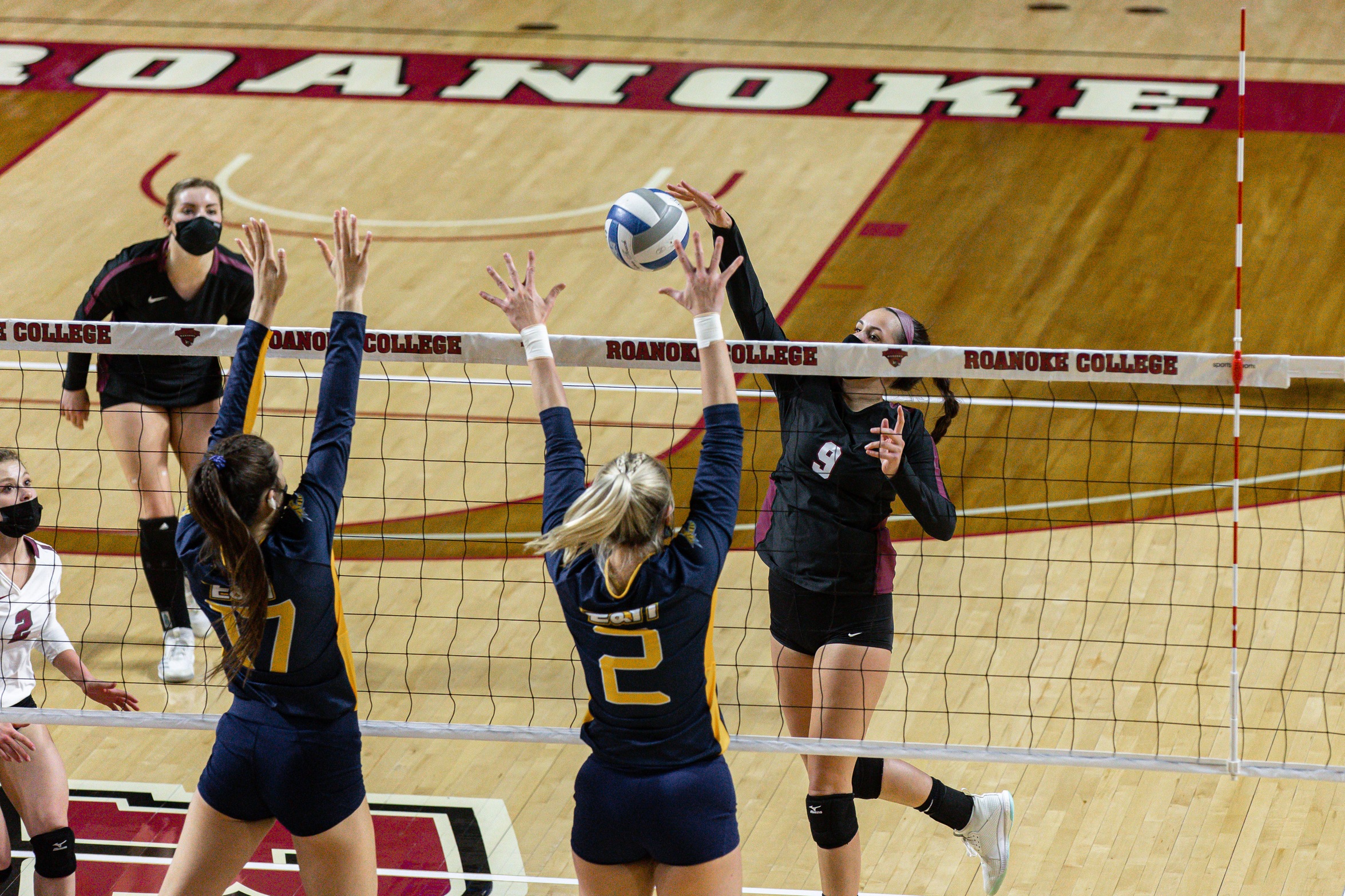 action photo of RC volleyball player Angel Ross (9) with an attack at the net