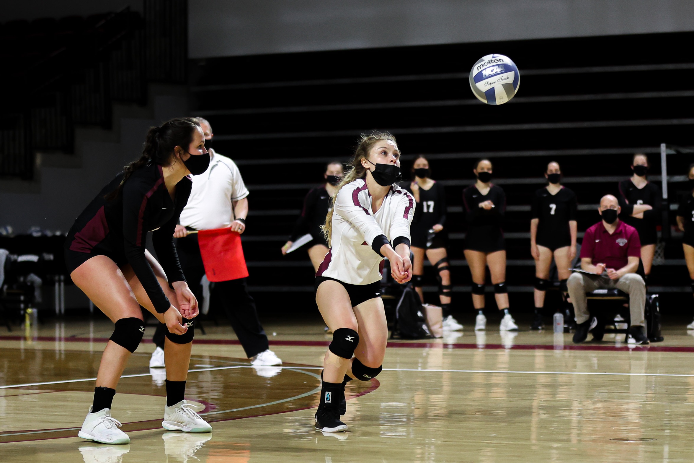 action photo of RC volleyball player Kennedy Clemmer with a dig