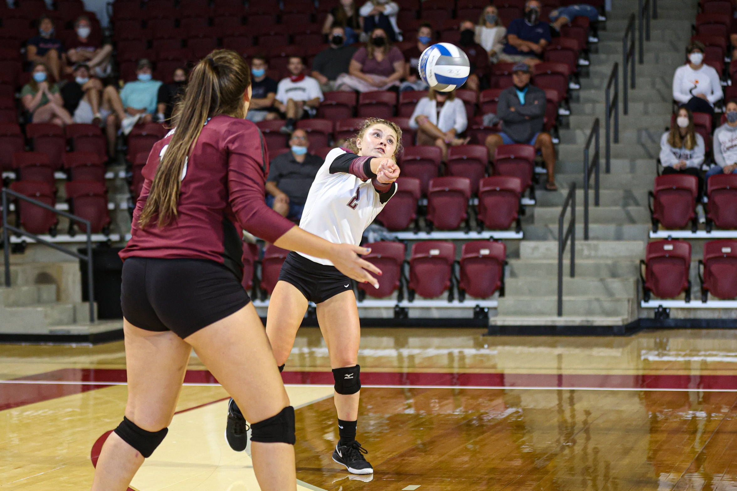 action photo of RC volleyball player Kennedy Clemmer with a dig