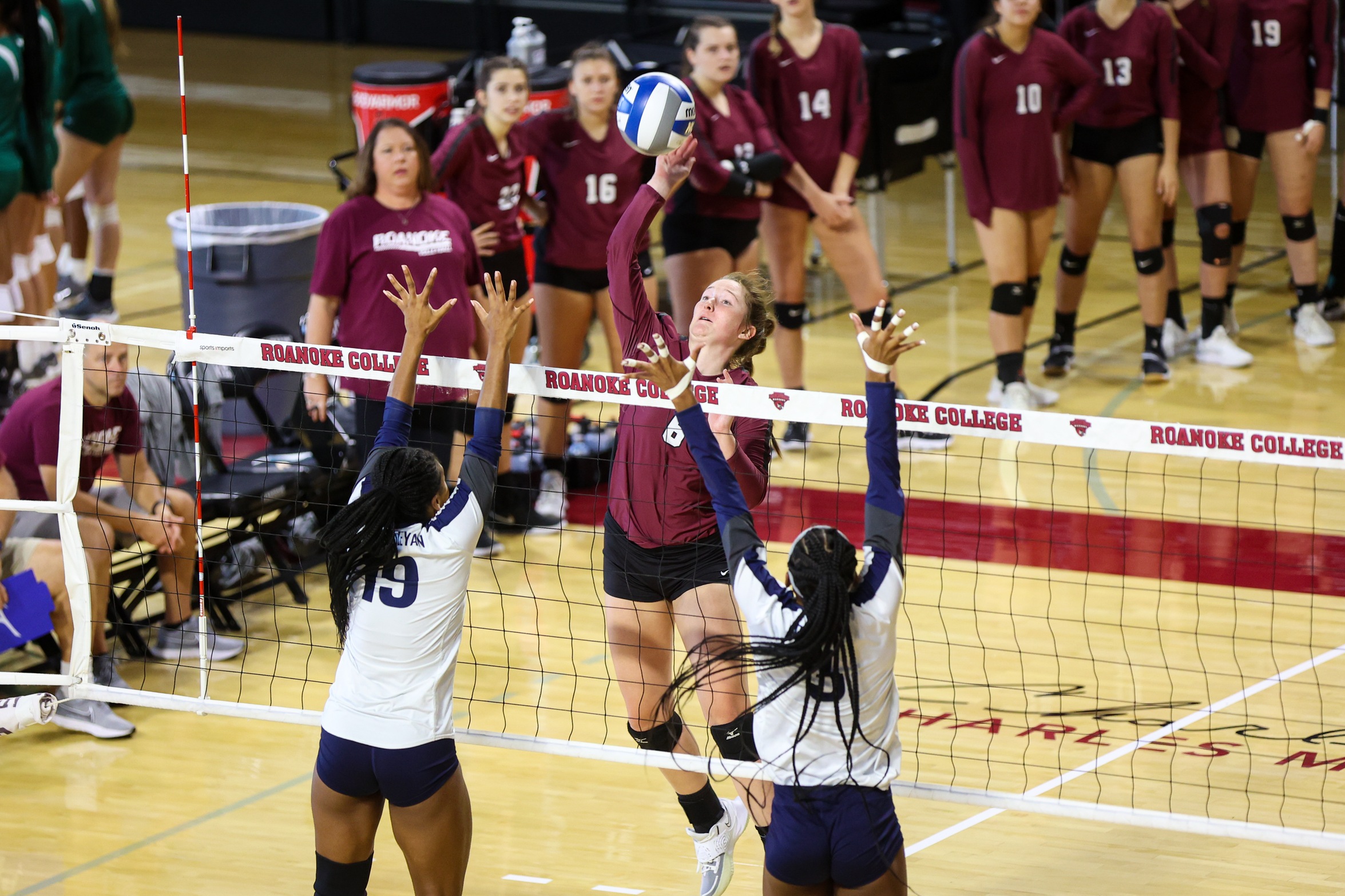 action photo of RC volleyball player Parker Moody attacking at the net.