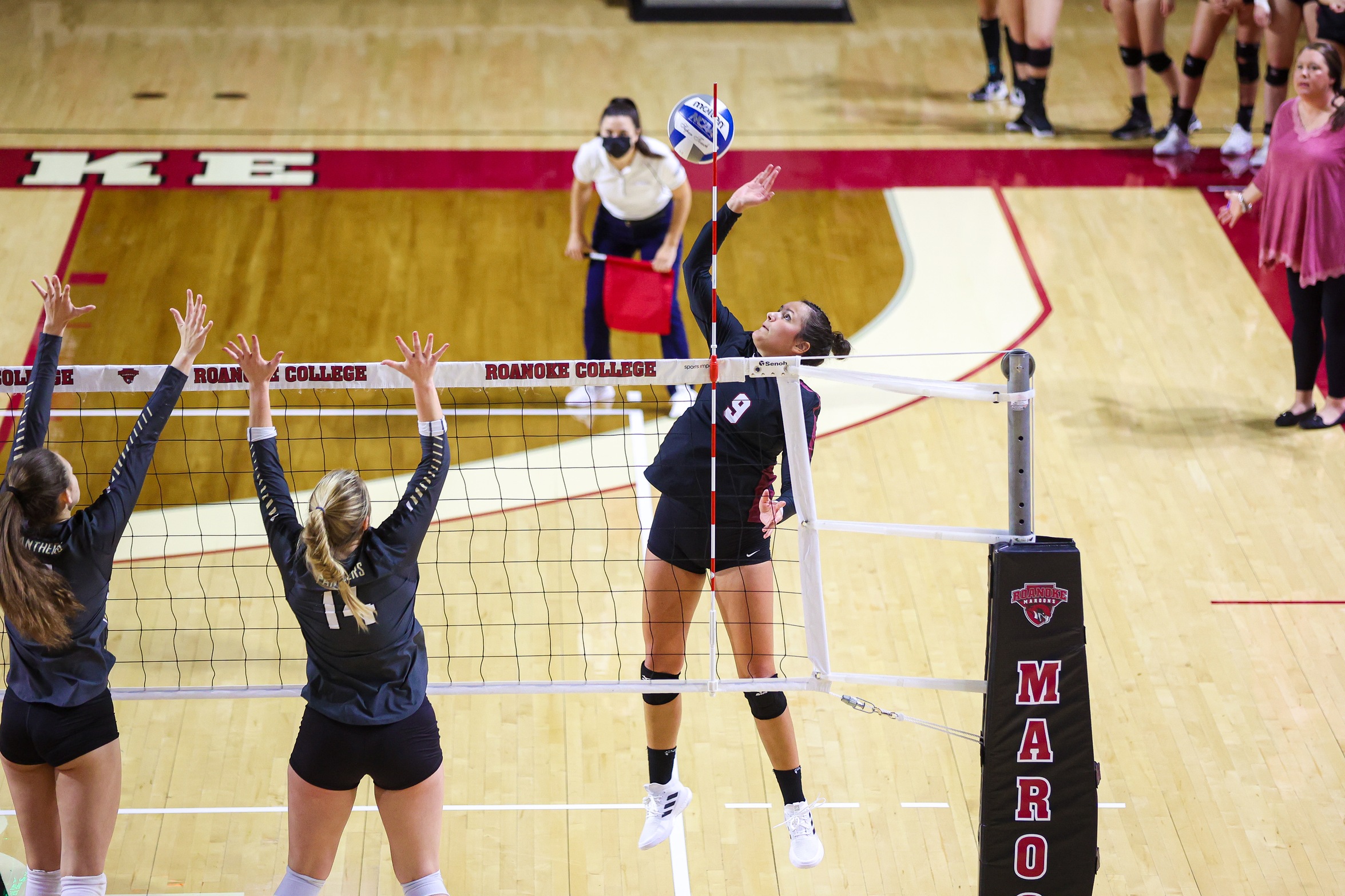 action photo of RC volleyball player Angel Ross with an attack